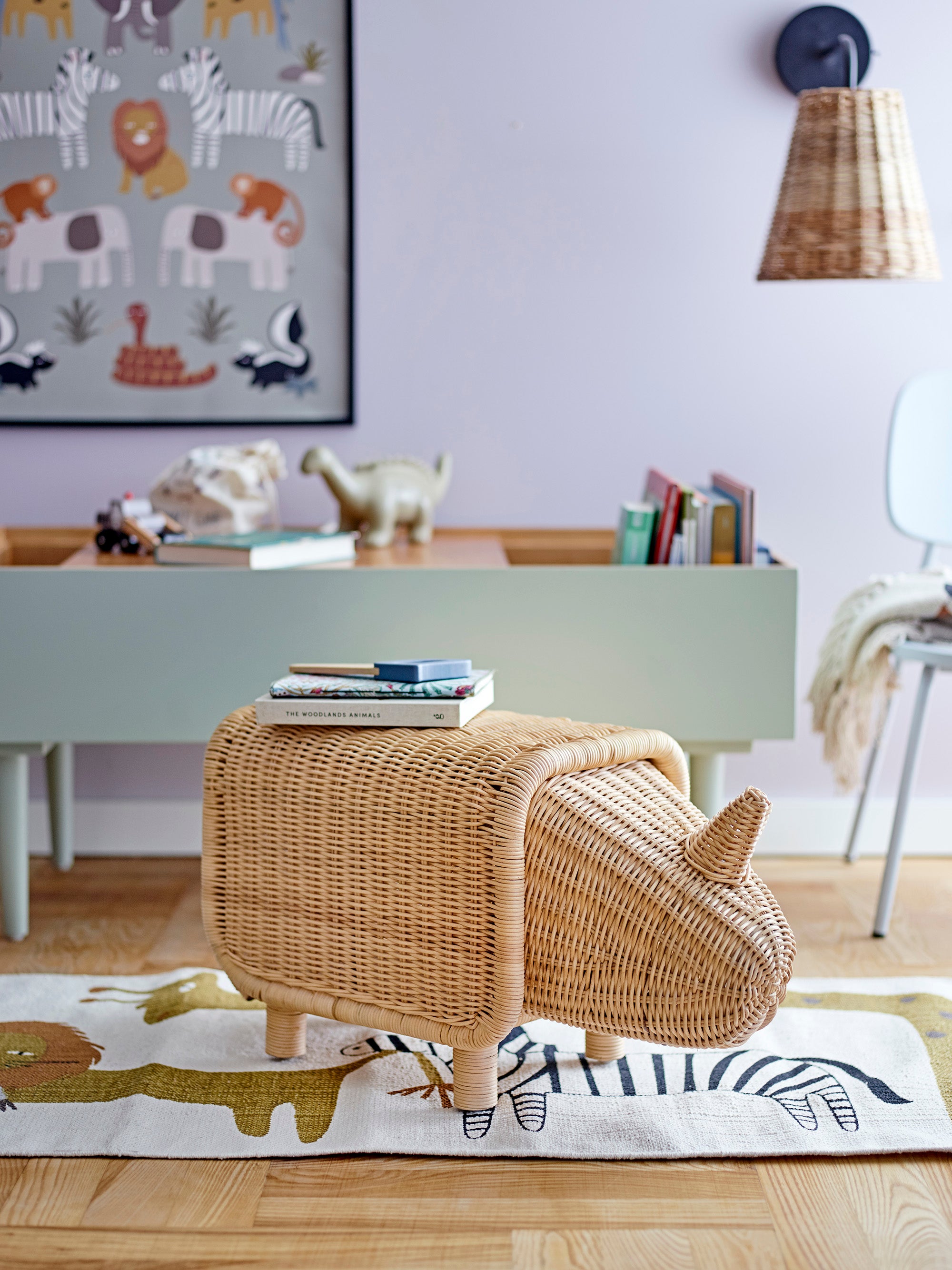 A children's room with a bench shaped as a rhino made from natural materials