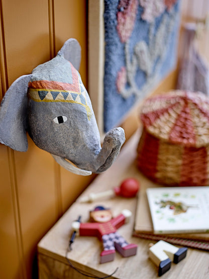 Wall decor shaped and colored as an elephant hanging on a wall 